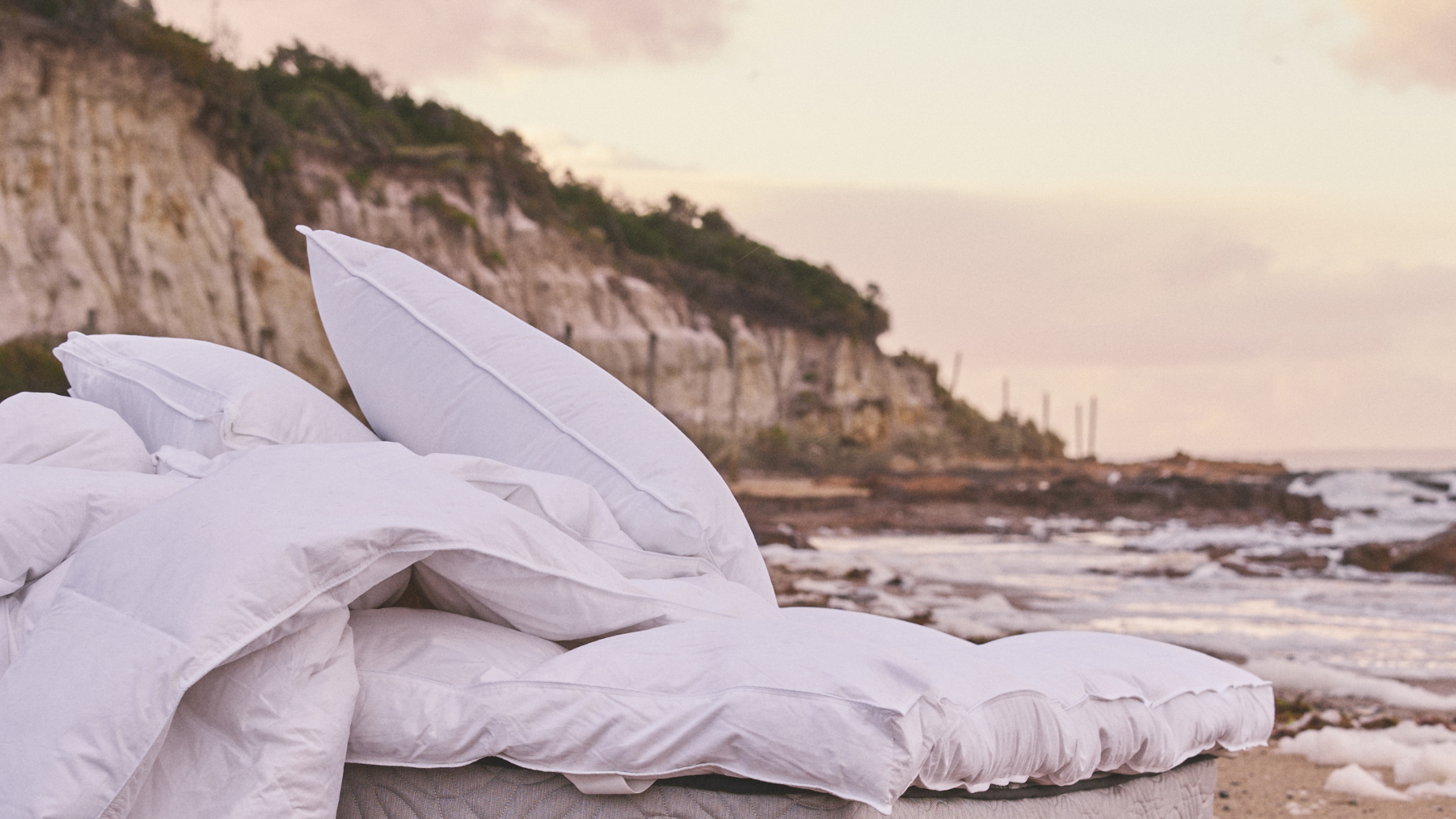luxury bed on the beach at sunrise